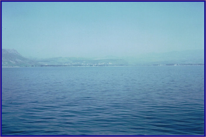 Cliffs of Arbel on the left side of the photo and the town of Magdala below them